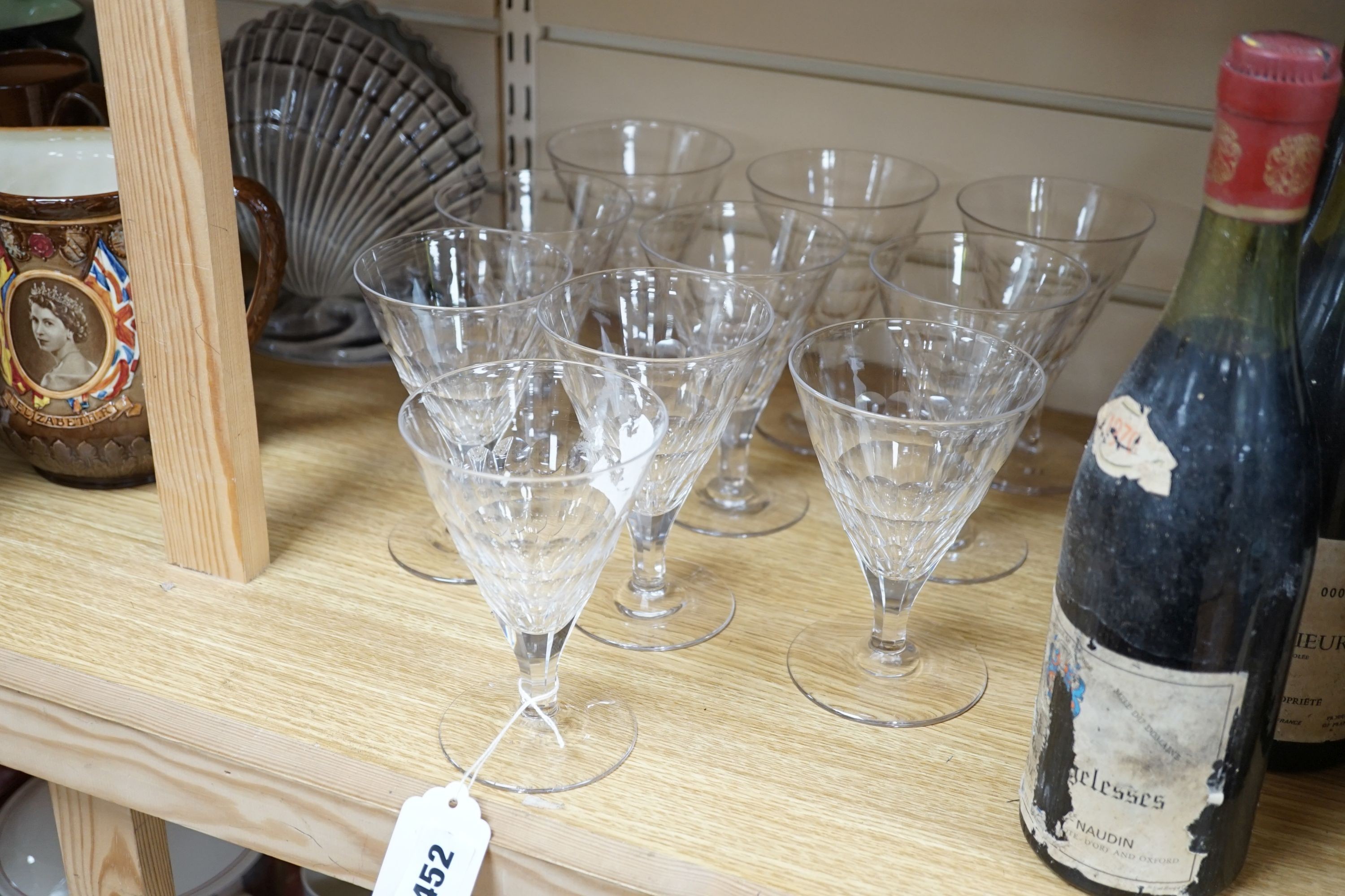 A set of ten facet cut conical wine glasses, 14cm